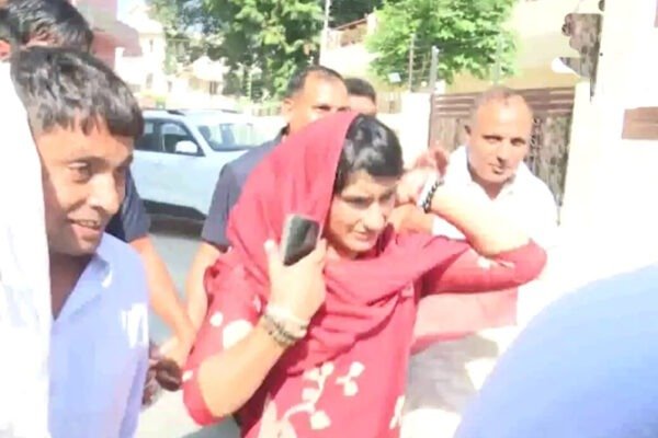 Congress candidate from Julana Vinesh Phogat leaves from a counting center