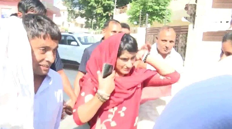 Congress candidate from Julana Vinesh Phogat leaves from a counting center