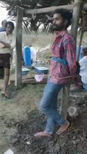 కోనసీమలో పర్యావరణ కార్యకర్తను స్తంభానికి కట్టేసి దాడి చేసిన ఆక్వా రైతులు