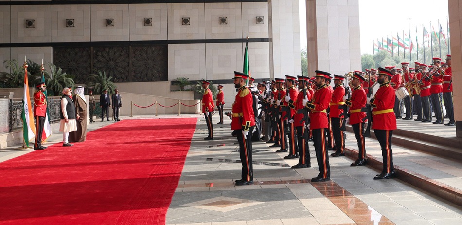 PM receiving Guard of Honour at Bayan Palace, in Kuwait on December 22, 2024.