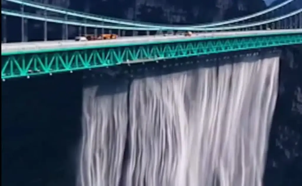 An artificial waterfall cascading from the world's highest bridge